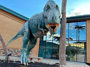 Toothy T. rex: your Dinosaur Resource Center greeter.