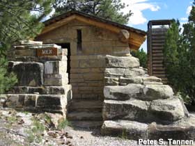 CCC-built stone and log outhouse.